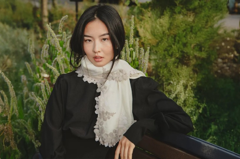 : Ivory Wool and Silk Scarf with Beige Scalloped Lace Border Styled Outdoors by Maneesha Ruia